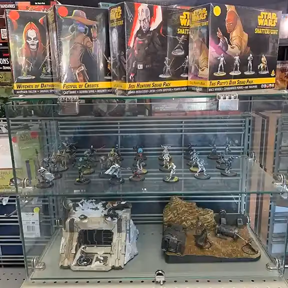 Star Wars figures and miniatures in a glass case