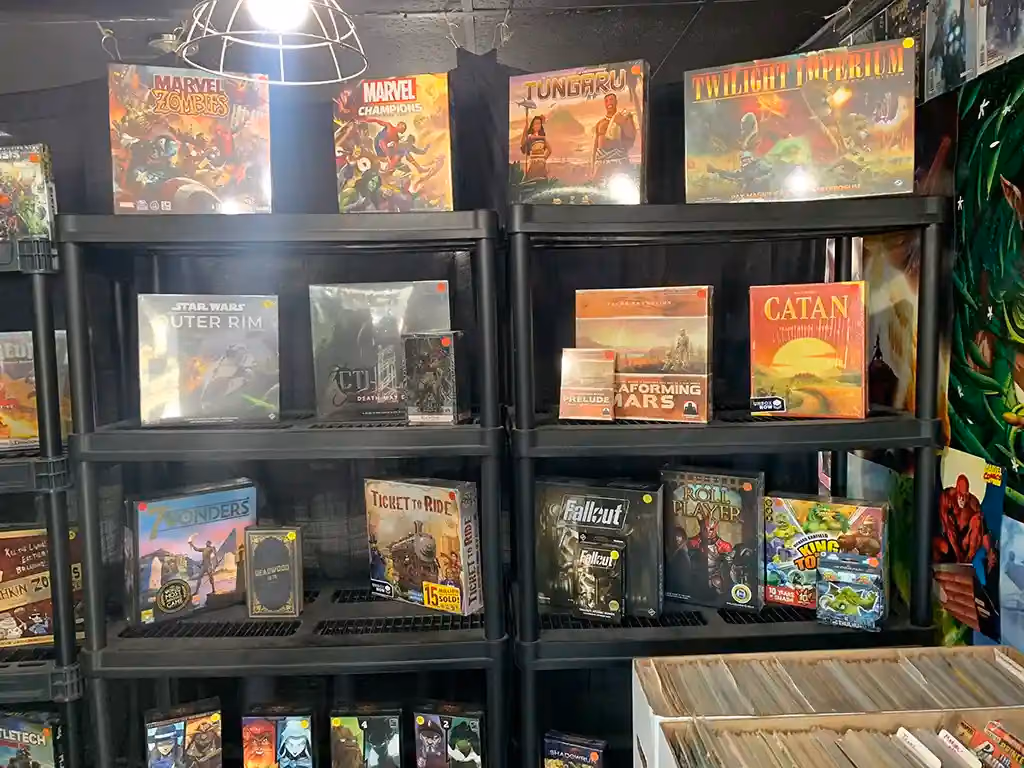 Shelves of board games, including Catan