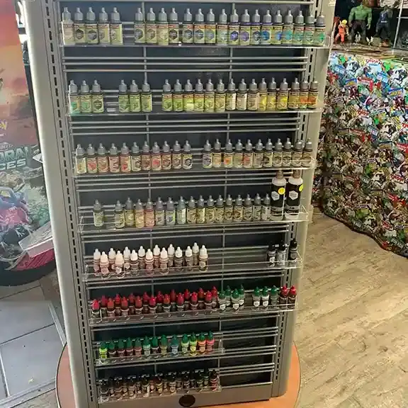 A tall rack of miniature paints