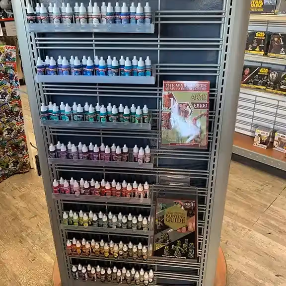 A rack of hobby paints in many colors