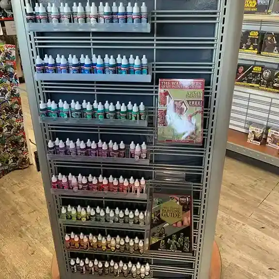 A rack of hobby paints in many colors