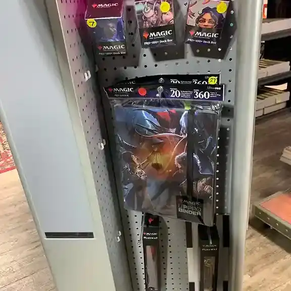Card game accessories hanging on a pegboard