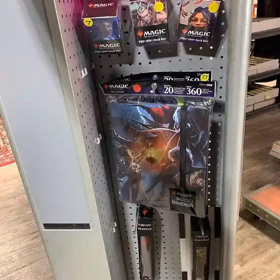Card game accessories hanging on a pegboard