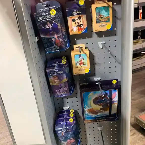 Trading card accessories and sleeves on a pegboard