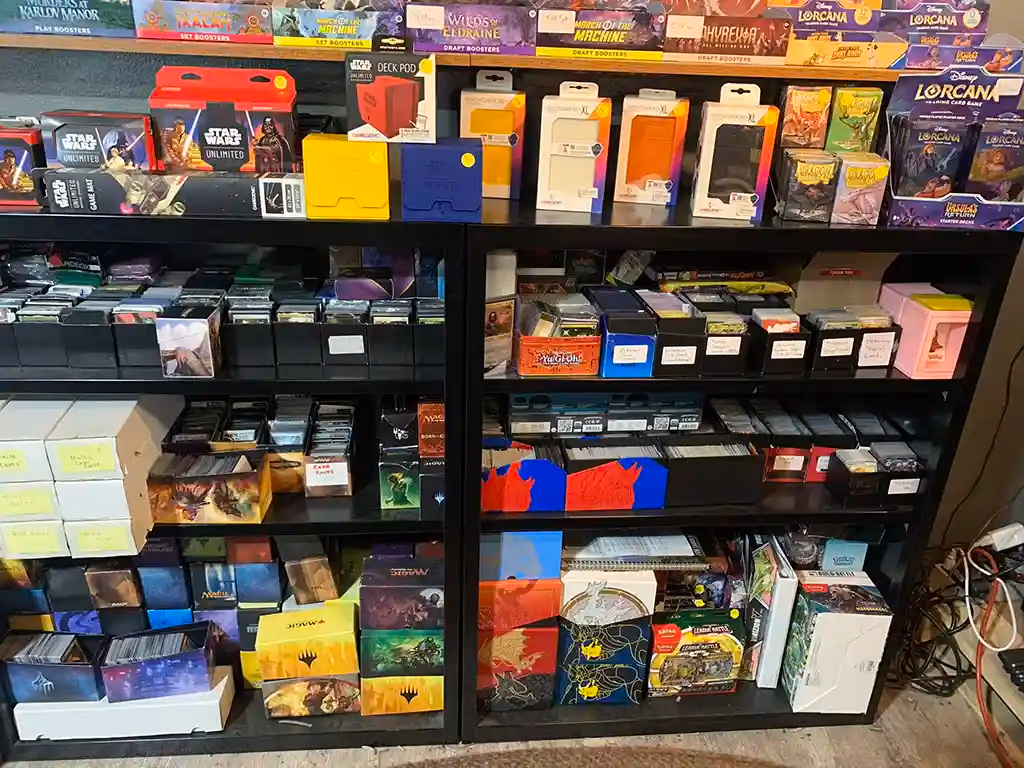 A wall of deck boxes and card supplies